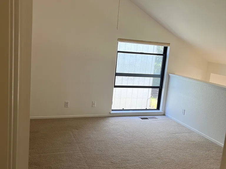 Lofted primary bedroom