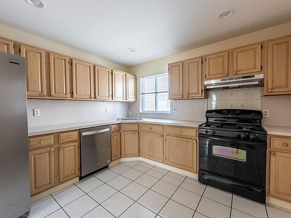 Kitchen with lots of cabinets and countertops
