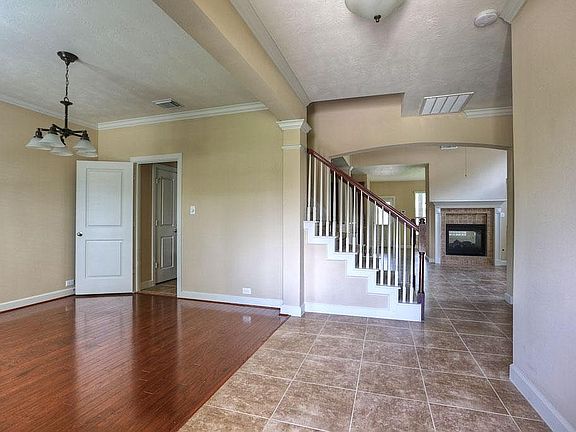 As you enter the home, the dining room is to your left.