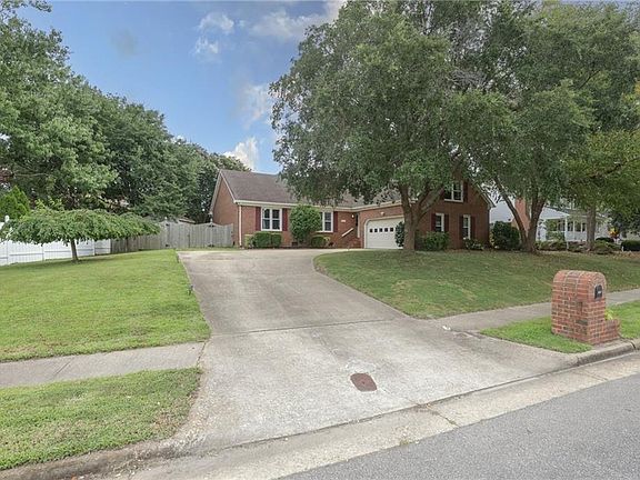 The home is set back on the lot, providing additional privacy.