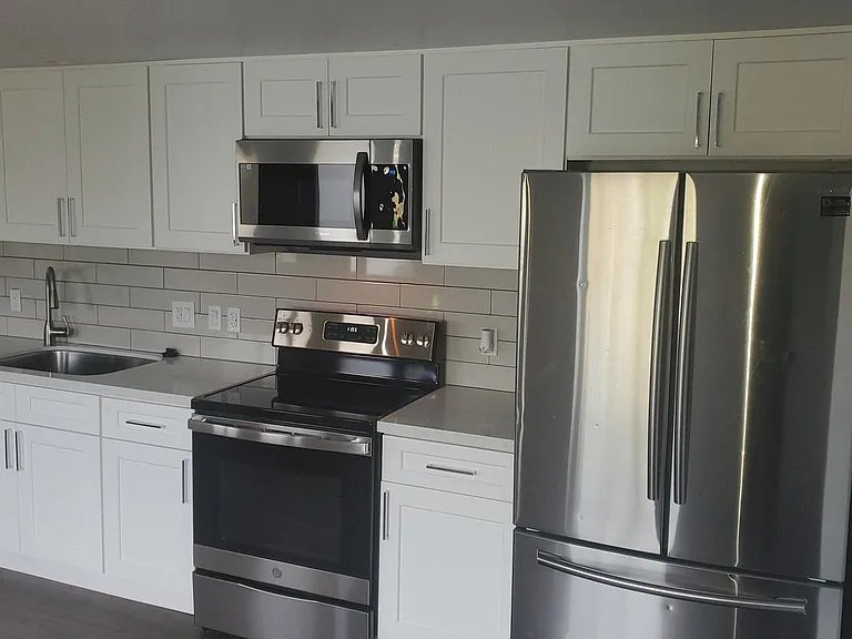 All new full-size appliances, with quartz counters and ample cabinet space.