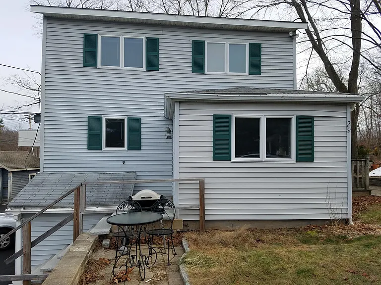 Side of house with stairs to entryway