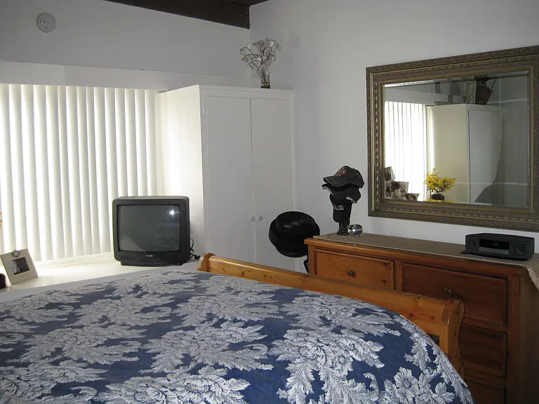 Archival photo of the bedroom.