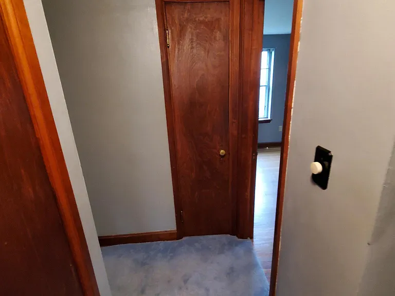 Hallway with linen closet