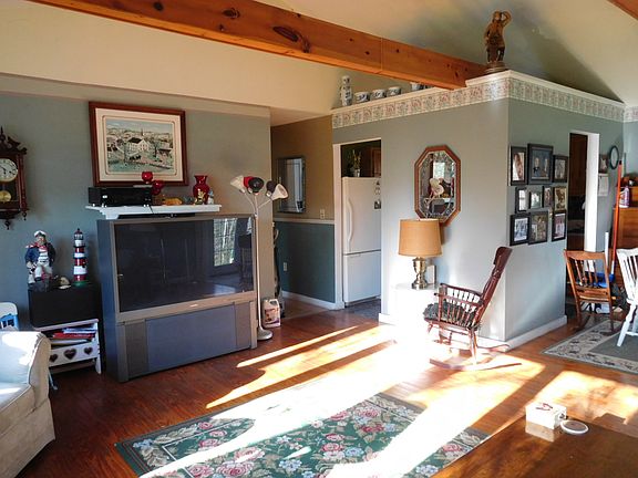 Living room showing kitchen 