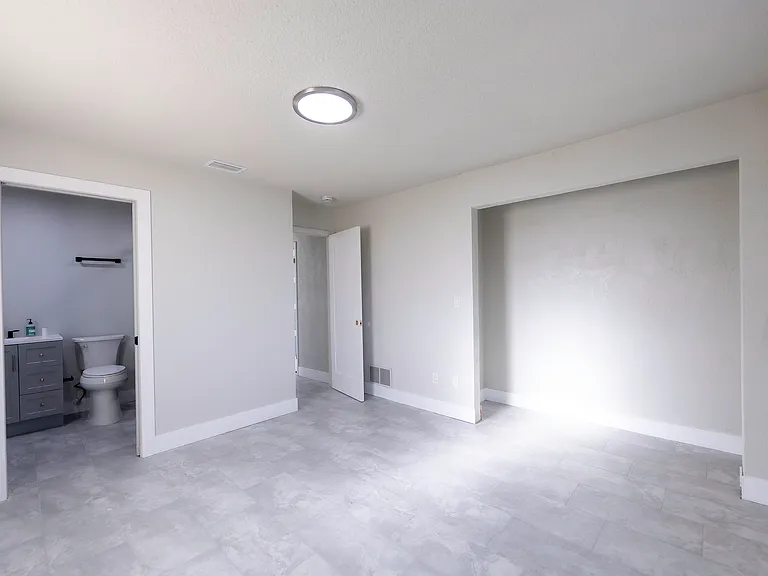 main en-suite. Bathroom includes newly remodeled floor to tile walk-in shower and vanity.