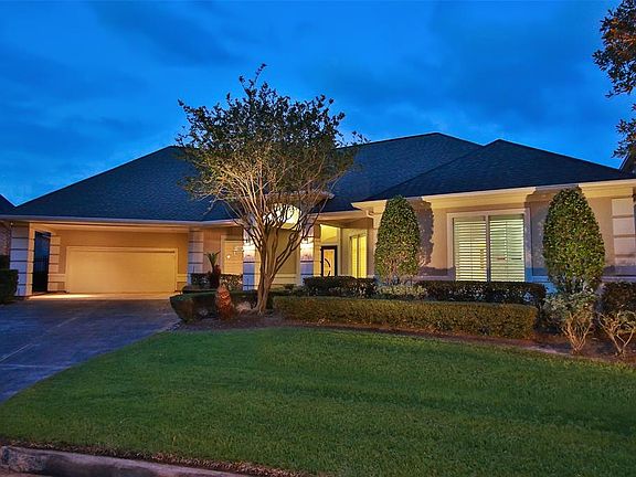 BEAUTIFULLY SITUATED ON A CIRCULAR DRIVE WITH A PARK-LIKE ISLAND SETTING.