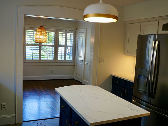 Bright kitchen opening to dining room