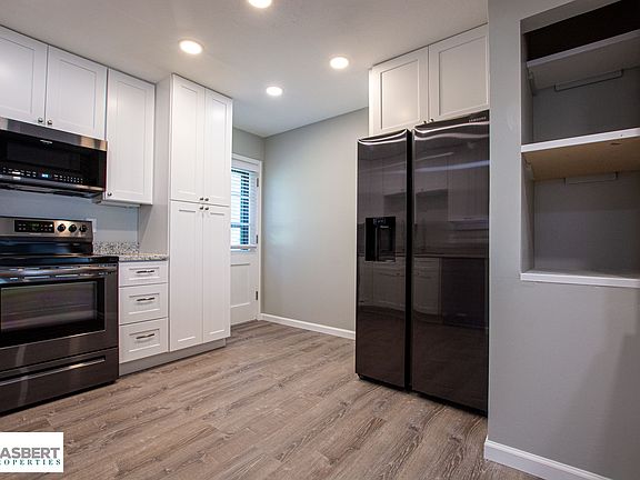 This kitchen is new in every way, including a fridge with ice and water in the door.