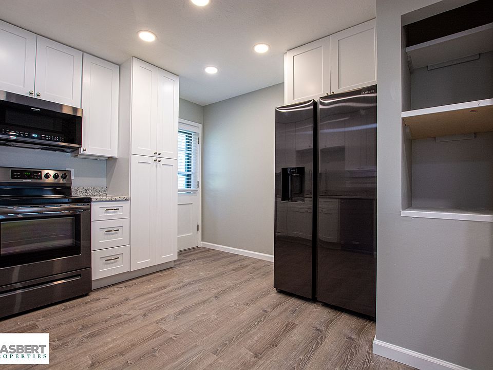 This kitchen is new in every way, including a fridge with ice and water in the door.
