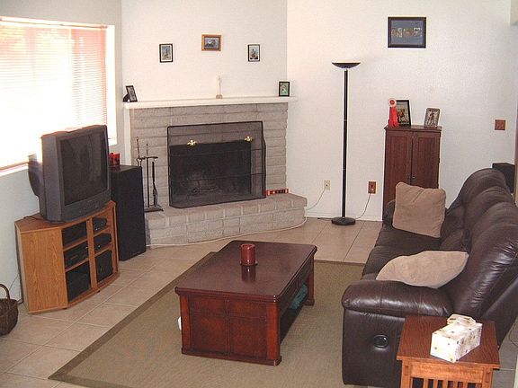 living room w/ cozy fireplace