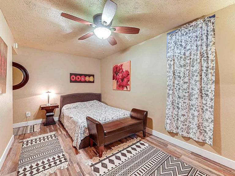 Downstairs queen bedroom with walk in closet. Includes TV and Roku for streaming.
