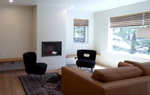 Comfortable shared living space with built-ins, lots of natural light.