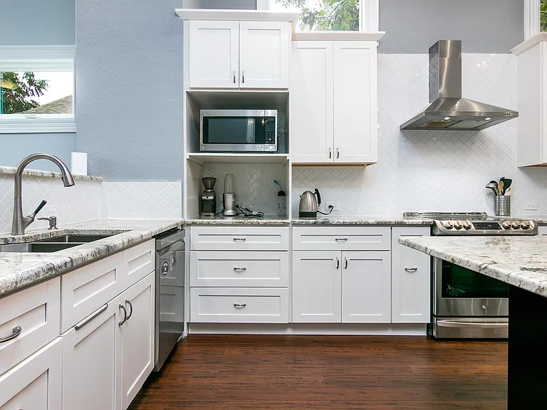 Roomy kitchen w/stainless steel appliances, including a built-in wine fridge. Microwave included.