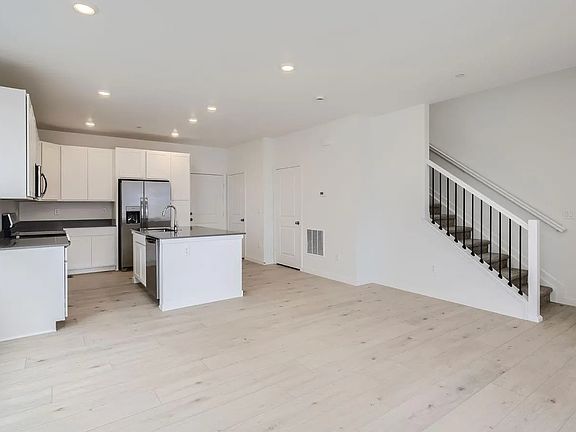 Open floor plan with kitchen adjacent to great room
