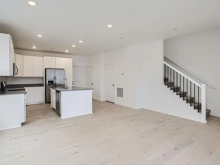 Open floor plan with kitchen adjacent to great room