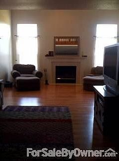 living room
						:
						wood burning fireplace. Updated laminate floors.