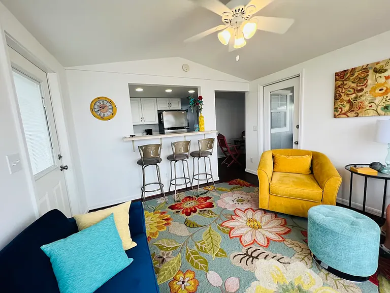 Living room looking into kitchen and dining
