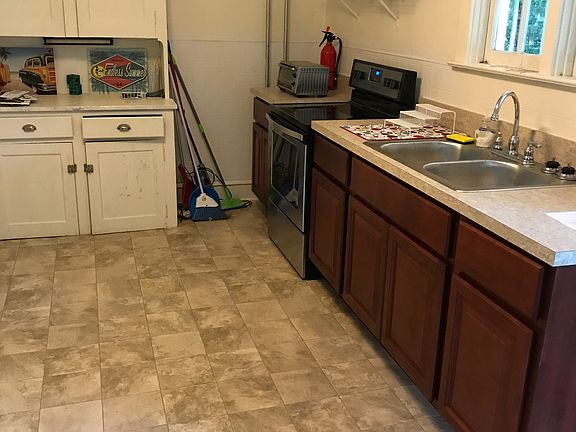 Another view of the kitchen. Flooring is laminate that resembles tile. Easy to clean with no grout.