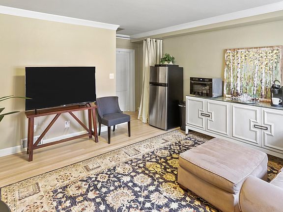 spacious living area includes refrigerator/freezer, convection microwave and buffet for food and drinks.