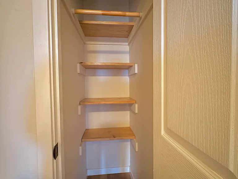 Storage closet at the top of the stairs