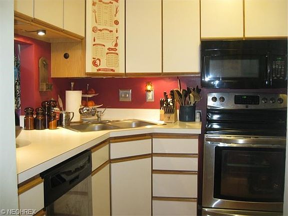 Corner Sink & Maytag Stainless Steel Dishwasher! Kitchen offers Plenty of Cabinets & Pergo Floor!