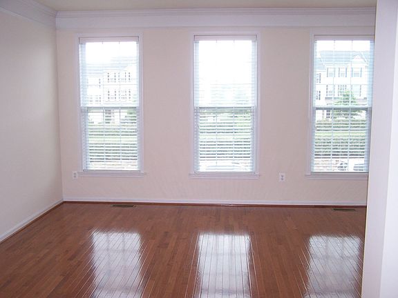 Living rooom with gleaming hardwoods