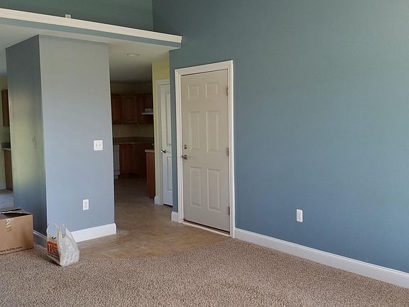 Living room and door leading into garage