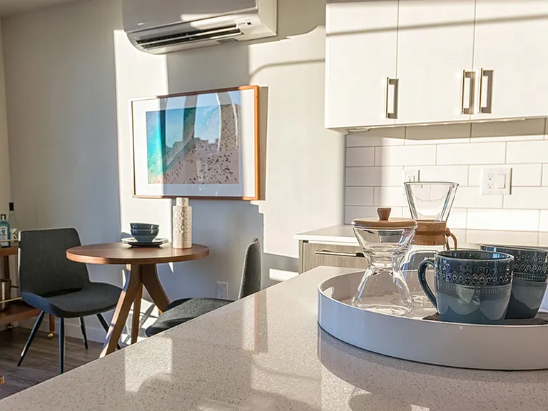 Our kitchens feature high-end finishes including quartz countertops and tile backsplashes