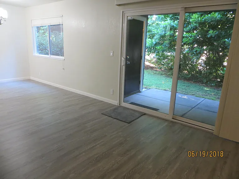 Living Room to patio and Garden/Greenbelt and Redwood trees.