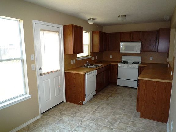 Dark Cabinets -- GE Appliances -- New Ceramic Tile