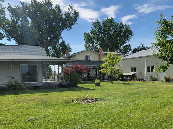 Cottage on left with landlord's shop and farmhouse in the background
