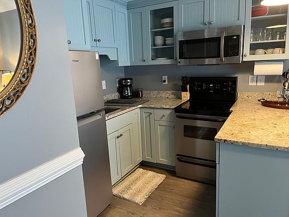 Kitchen- Dishes-Pots and Pans. Full size fridge, stove and microwave. Everything in picture is included.