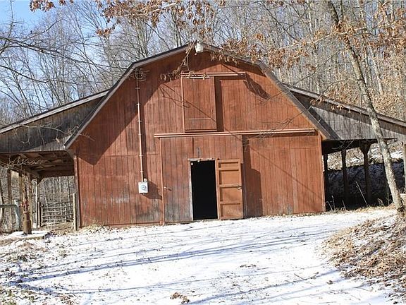 Barn. 30x60 barn with 4 horse stalls, lots of storage, hay loft, and outside patio.