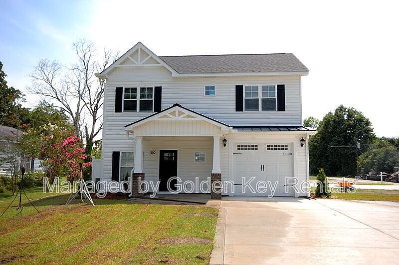 1st image of 302 E 3rd St