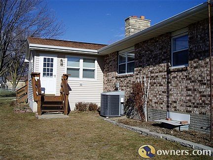 Maint.-free sunroom looks over open field;  deck on N side.