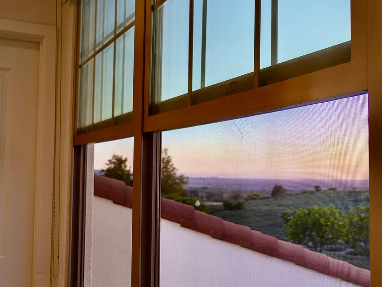 Primary Bedroom View: A beautiful daily backdrop featuring panoramic views of both the nature reserve and the distant city skyline.