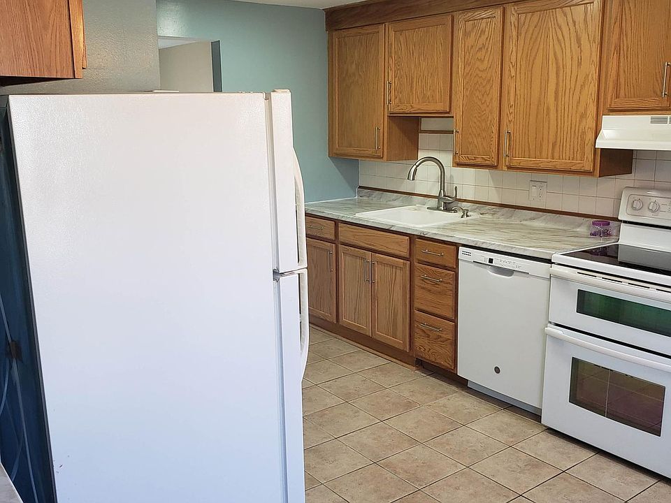 Fully equipped kitchen with double oven, quiet dishwasher, and fridge with ice maker