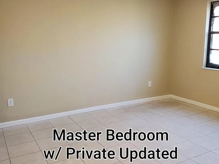 Large master bedroom with walk. in-closet and private bathroom with walk in shower.