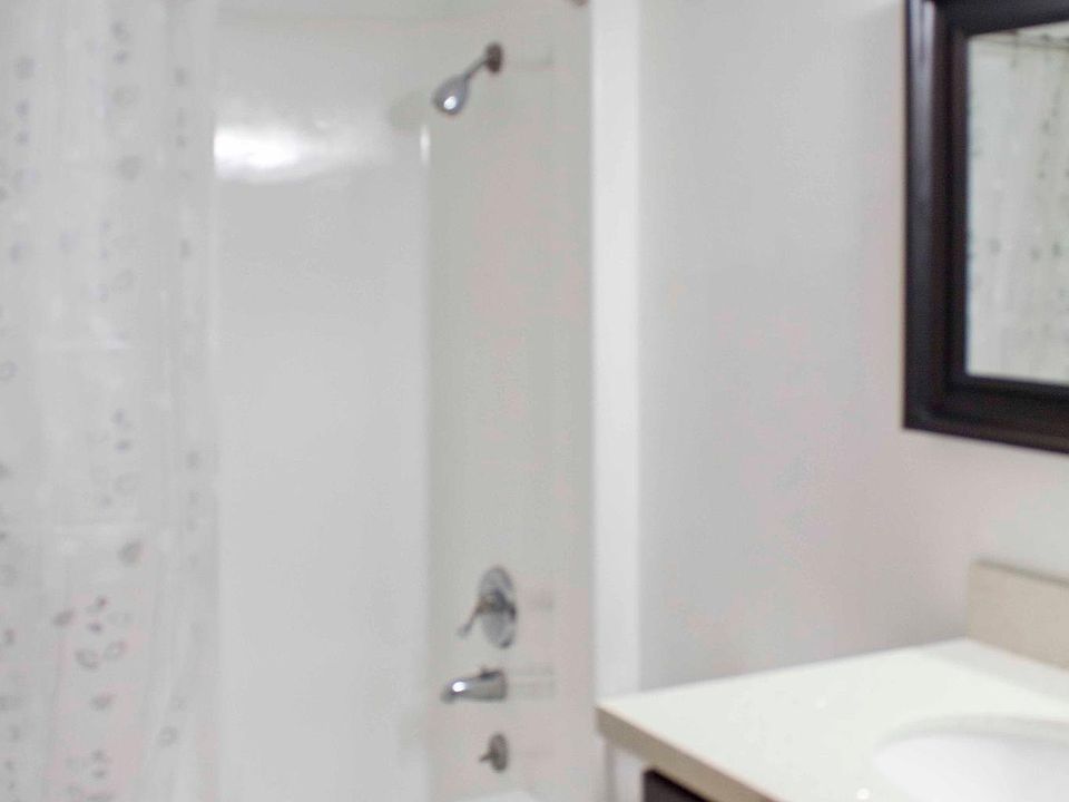 remodeled bathroom, with new quartz countertops, cabinets, s