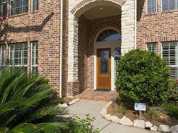   Beautiful stone front covered porch greets you into this wonderful home.