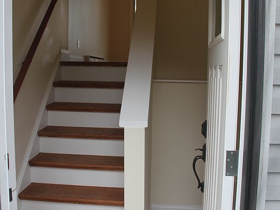 oak hardwood stairs from front door entry