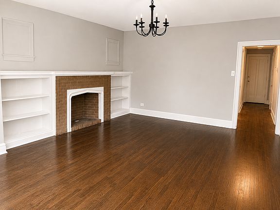 Living Room with Brick Fireplace
