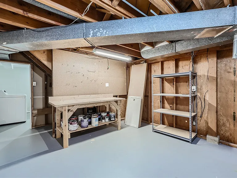 Utility room with great work bench for any projects plus extra storage
