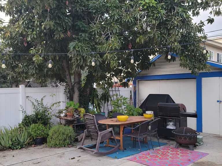 Communal outdoor dining and BBQ in the rear of the property.