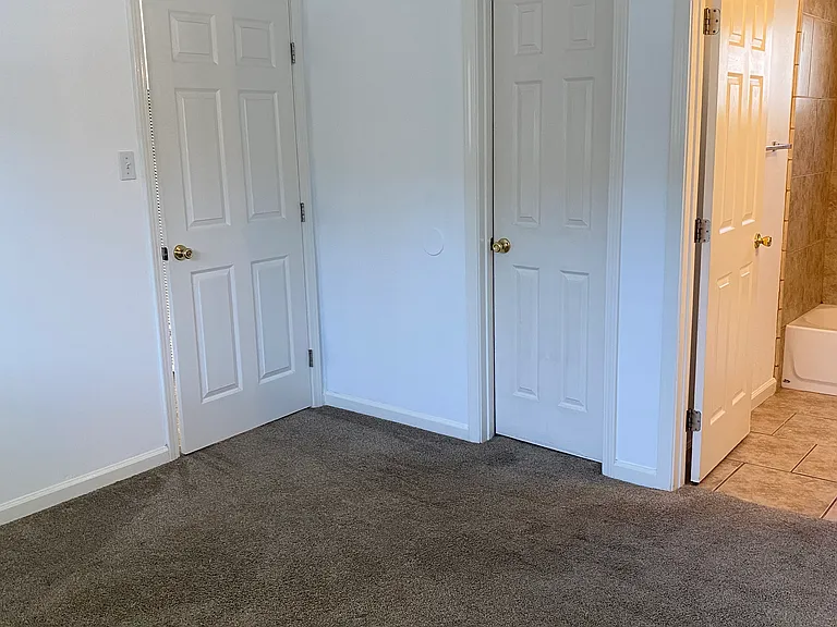 Bedroom features a walk in closet and bathroom