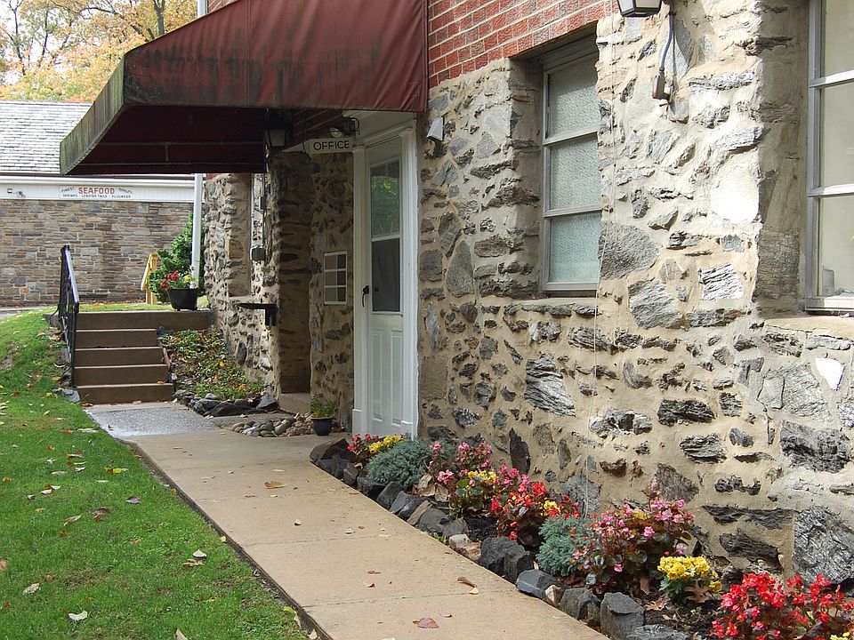 Sidewalk to apartment from off street parking lot.
