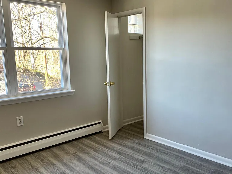 Fully renovated living room with coat closet