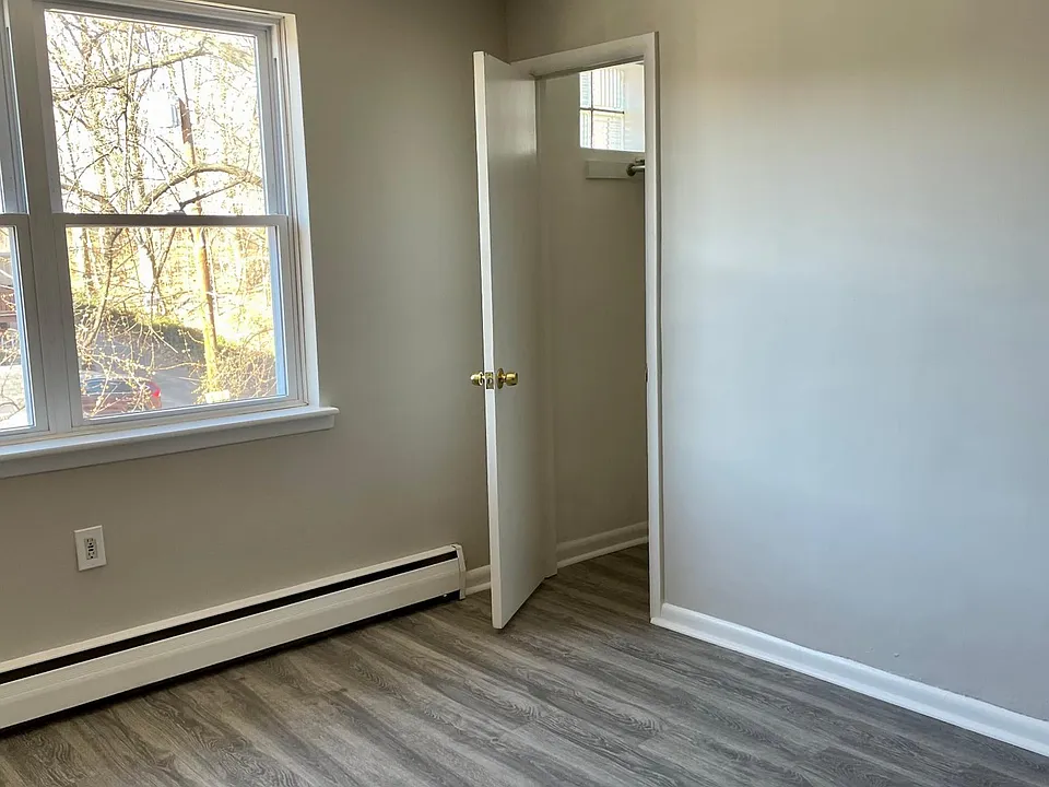 Fully renovated living room with coat closet