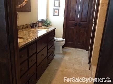 Master bath
						:
						Travertine tile; two sinks, oil rubbed bronze fixtures; walk-in closet